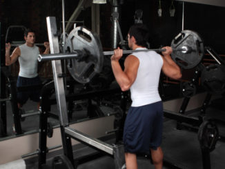 Man performing the squat exercise